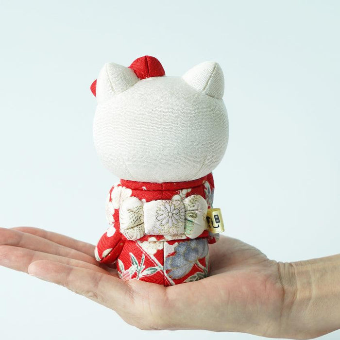 Handmade Hello Kitty lucky cat doll in red floral kimono, held in palm | Edo art dolls, Kakinuma Dolls
