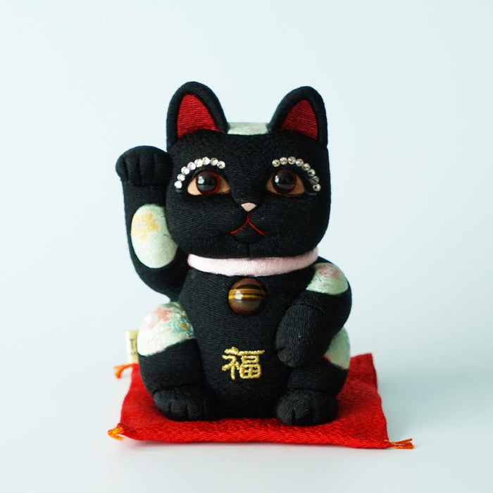 Black maneki neko lucky cat figurine with rhinestone eyes and gold fuku character | Edo art dolls, Kakinuma Dolls