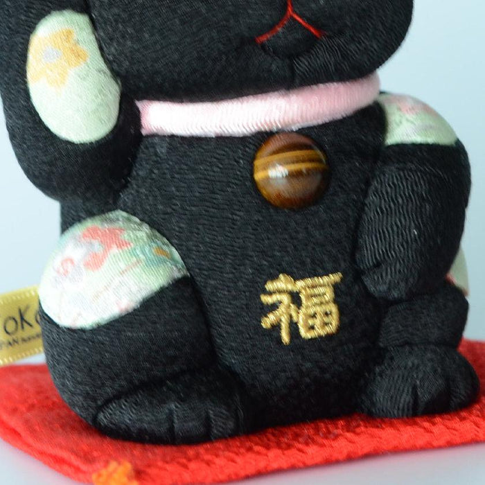 Black maneki neko lucky cat doll with gold kanji and tiger's eye bead | Edo art dolls, Kakinuma Dolls