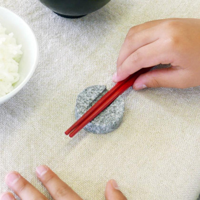 Stone chopstick rest holding red chopsticks at a dining table | Aji stone, Kagawa