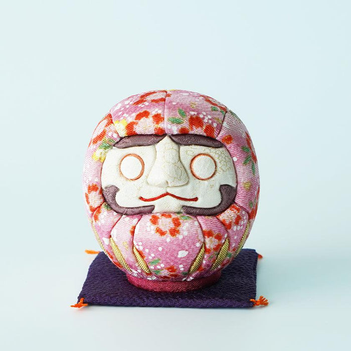 Pink floral chirimen fabric daruma doll on purple mat | Edo Art Dolls, Kakinuma Dolls