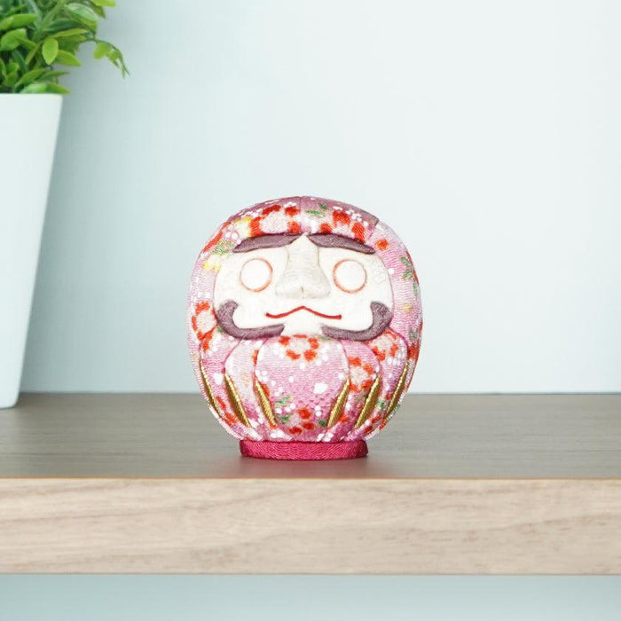 Pink floral chirimen fabric daruma doll on wooden shelf | Edo Art Dolls, Kakinuma Dolls