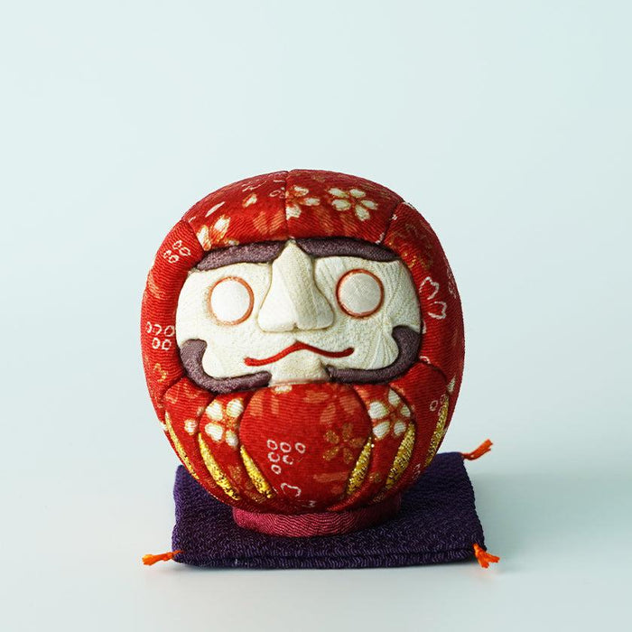 Red chirimen fabric daruma doll on purple cushion, Edo art doll | Tokyo, Kakinuma Dolls