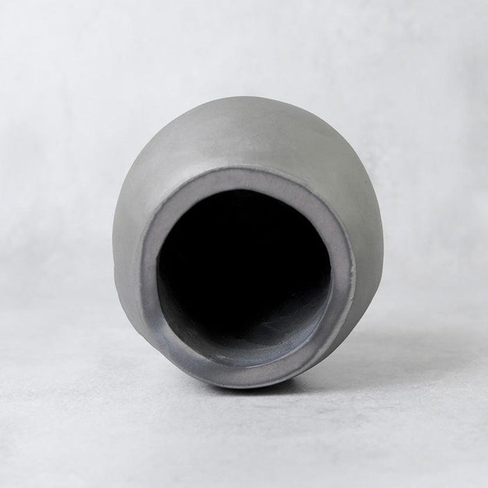 Top-down view inside a matte gray ceramic Oni-Daruma ornament, Awaji onigawara craft | Hyogo, GAROU