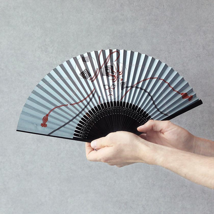 Japanese folding fan with blue kumadori kabuki pattern held open in hand | Nagoya folding fan, Suehirodo