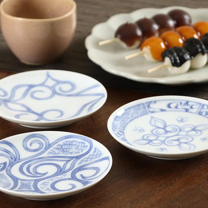 Blue and white hand-painted small ceramic plates styled with mitarashi dango and tea | Ainu crafts, Cikarpe Akan