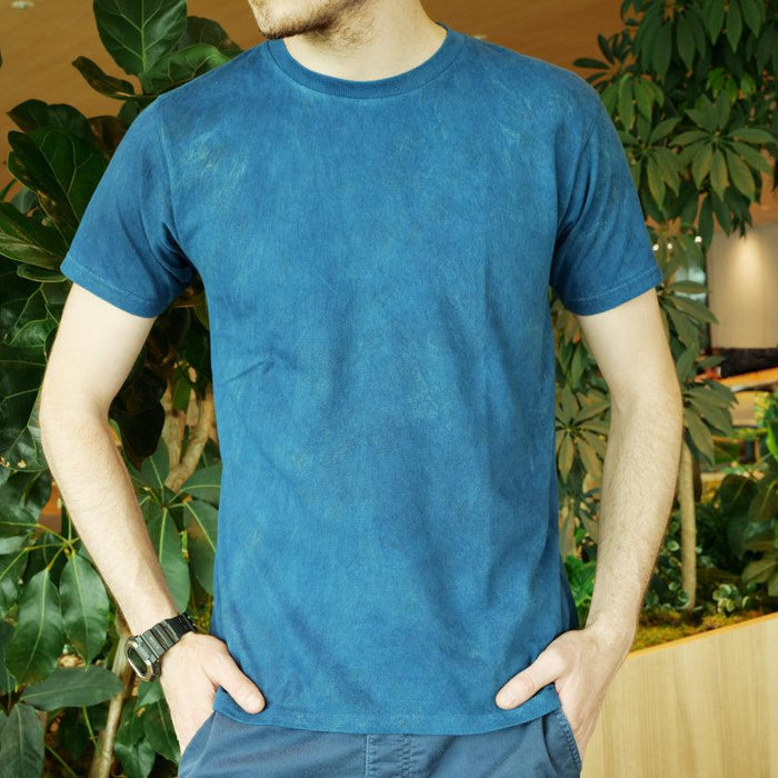 Natural indigo-dyed T-shirt in deep blue worn by a man | Indigo Kesennuma